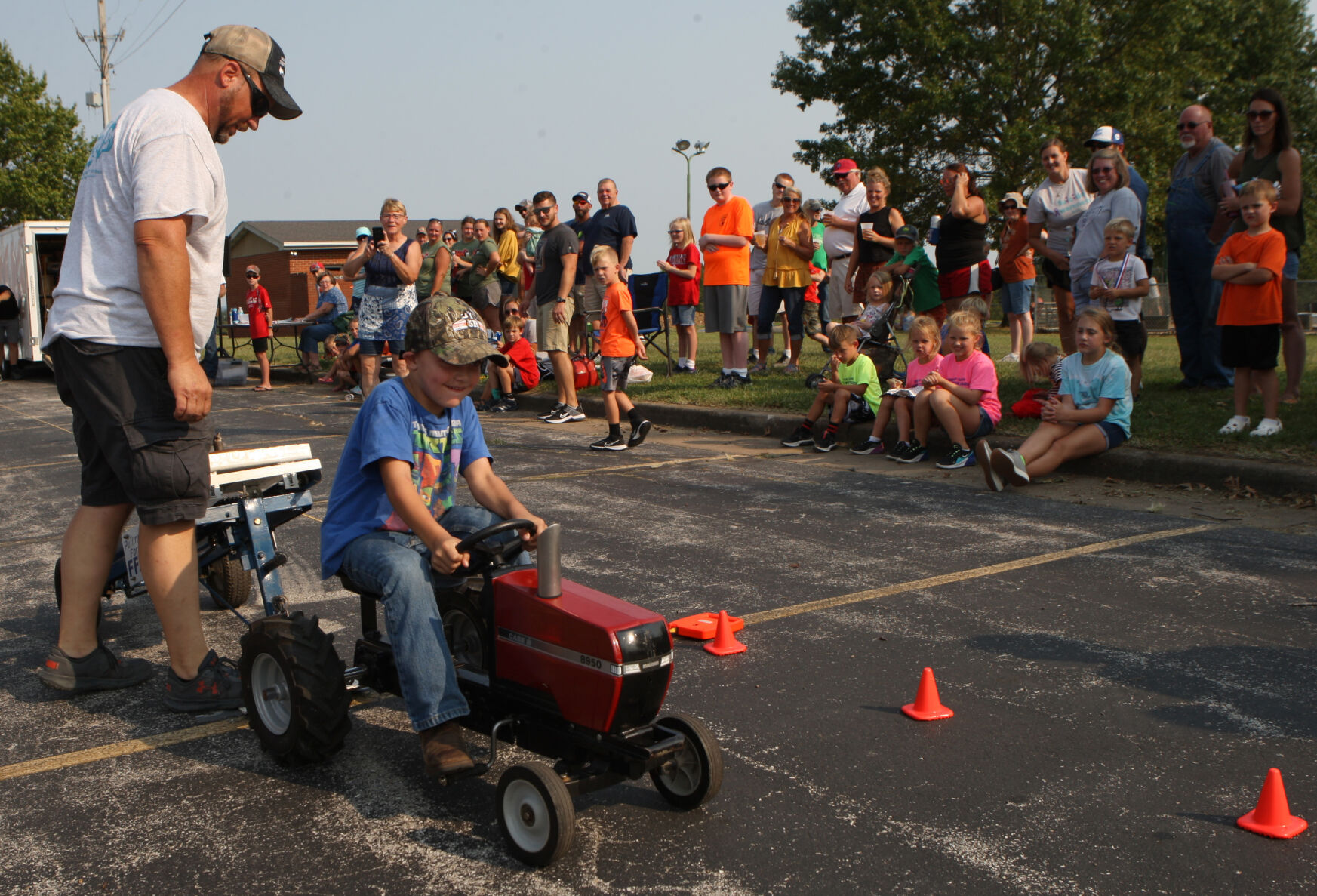 Arlo Brinker competes in the kids tractor pull
